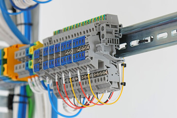 Electrical screw terminals for connecting wires in an electrical switchboard. Soft focus. Close-up.