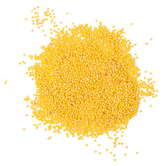 Isolated pile of millet groats on a white background, top view, copy space