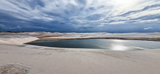 Dunes and lagoons of lagoa bonita, Lencois Maranhenses, Barreirinhas, Brazil. White sand dunes with pools of fresh water