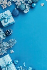 Festive blue Christmas border.  Gift boxes, ornaments, and greenery frame a vibrant blue background