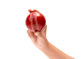 Athletes hand gripping a vibrant red cricket ball, isolated