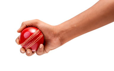 Bowlers hand gripping a red leather cricket ball ready to play.