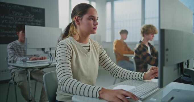 Female Student in University Computer Lab Studies Game Development. Young Woman Focused on Screen, Learning Programming and Design. Concept of Digital Education, Technology, Creative Skills. Portrait.
