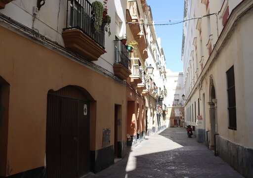 Narrow cobbled street in the Spanish city of Cadiz.