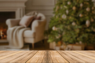 Wood table top on blur with bokeh christmas tree background - can be used for display or montage your products.