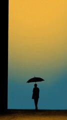 Silhouette of Person with Umbrella at Sunrise Against Gradient Sky