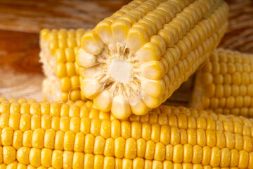 Sweet corn ears closeup. Fresh maize cob macro texture, autumn sweetcorn, corncob close up