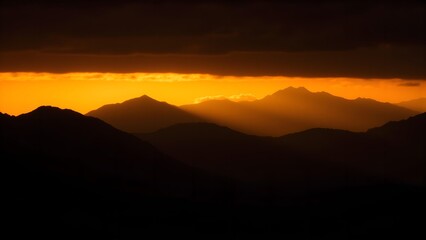 Obraz premium Golden dusk mountains silhouette