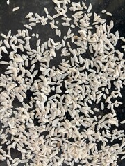 Raw flattened rice close up. Dry rice flakes or poha, Indian breakfast food