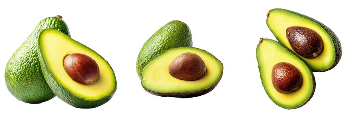 Fresh ripe green avocados whole and cut in half displaying creamy yellow flesh and large brown pits isolated on white