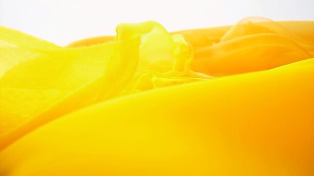 Abstract Yellow Fabric Flowing Waves Background.