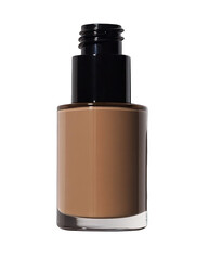Obraz premium Foundation bottle, black cap, dark tan product, against a dark background