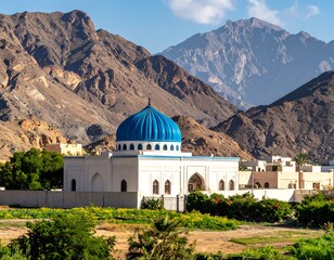 White building with blue dome set amidst mountains
