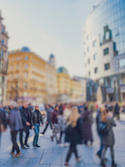 Obraz premium Crowd of anonymous people walking on busy city street