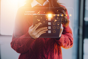 close up Man hand using computer Notebook with popup five star icon for feedback review satisfaction service, Customer service experience and business satisfaction survey.