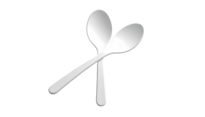 Two silver spoons overlapping against a stark black background, with shadows