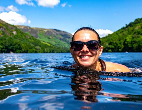 Woman open water swimming in the lakes