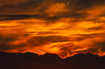 Magnificent sunset sky and cloudscape painting the horizon in golden hour in Sweden