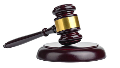 A wooden gavel with a gold band rests on its sound block against a black background