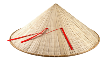 Conical straw hat with red ties on a black background, traditional Asian headwear