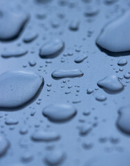 A blue surface with water droplets on it