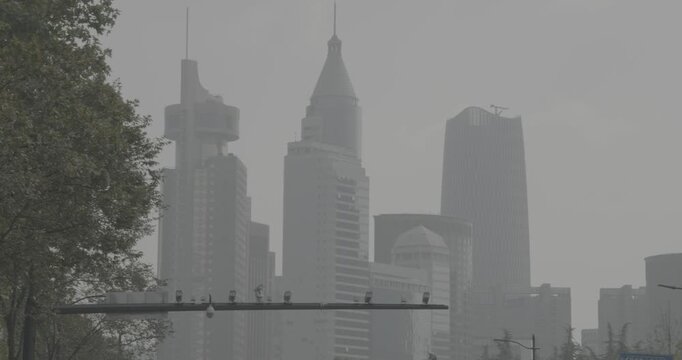 Misty skyline showing iconic buildings of a modern metropolis in soft light. Shanghai, China