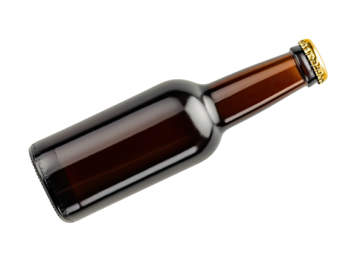 Tilted amber glass bottle, gold cap, isolated