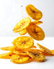 Crispy banana chips in mid-air, scattered