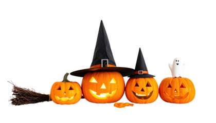 Carved pumpkins and a ghost with witch hats and broom against black