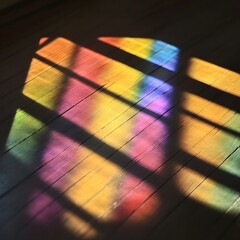 Rainbow Stained Glass Window Shadow on Wooden Floor