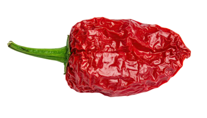 Close-up of a vibrant red, wrinkled pepper, with a green stem against black