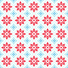 Seamless vector pattern with abstract geometric red and blue floral elements on a light background. Vector illustration