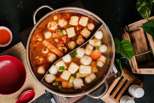 Spicy Taiwanese hot pot with various steamboat included crab sticks, fish balls, and tofu. Top View 