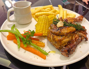 grilled chicken steak with vegetables and salad