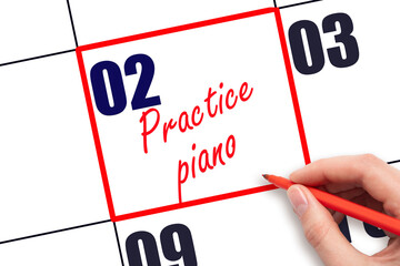 2 nd day of the month. Hand writing Practice piano reminder and drawing red frame on calendar with...