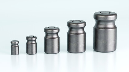 3D rendering of different size of metal calibration weight on color background