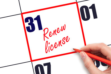 31 st day of the month.  Hand writing Renew license reminder and drawing red frame on calendar with red pen on white background. Business concept. Planning and scheduling