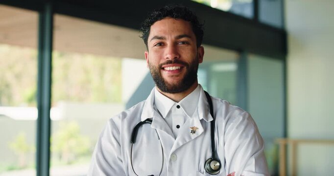 Face, man and doctor with arms crossed in hospital for career pride, about us and medical services. Portrait, surgeon and confident with ambition, patient care and positive attitude for healthcare