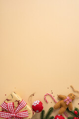 Vertical festive scene with gifts, candy cane, gingerbread bear, red ornament and pine branches on...