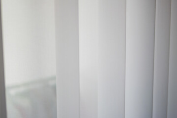 Curtains partially open bright interior room minimalist design close-up light and space