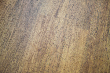 Close-up of wood grain texture indoor setting natural material warm tones detailed perspective