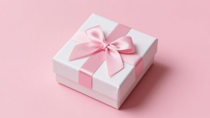 Fototapeta premium White gift box with pink ribbon on a pink background