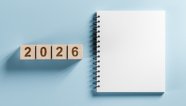2026 year goals concept with wooden blocks and blank spiral notebook for action plan and to-do list on blue background - Powered by Adobe