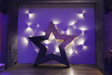 Star decoration with soft lighting creates a cozy atmosphere for an event