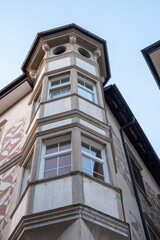 Ancient building with bay window in the historic center of Bolzano, in Northern Italy