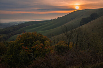 October sunrise from Firle Beacon on the south downs east Sussex south east England UK
