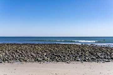 Alluvial gravel, sand and clay of flood plains. Malibu Lagoon State Beach, Malibu is a beach city in the Santa Monica Mountains region of Los Angeles County, California. intertidal zone