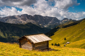 Scenic Mountain Landscape in the Dolomites, Italy.
Alpine Meadow with Peaks and mountain hut and pasture