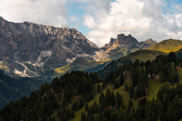 Scenic Mountain Landscape in the Dolomites, Italy. Dolomites Mountain Range. Mountain panorama with cloudy sky
