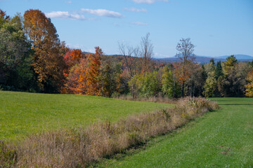 View of fall colors on a farm in the Canadian countryside in the province of Quebec